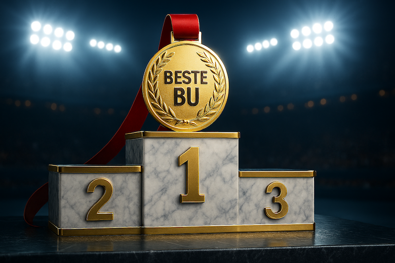 Eine Medaille mit dem Text "Beste BU" auf einem Sieger-Treppchen